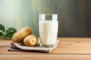 Glass of potato milk and raw potato tubers, copy space. Alternative plant based milk. Healthy food. AI generated. photo