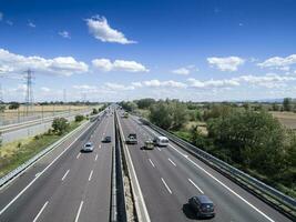 cars trucks person and stocks on motorway photo