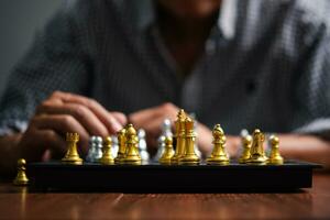 Success and plan in Business Strategy. Businessman in a Chess Game of Skill and Critical Thinking photo