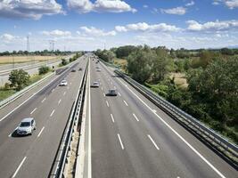 cars trucks person and stocks on motorway photo