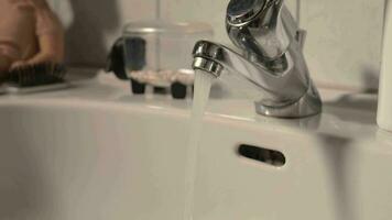 a faucet is running water from a sink video