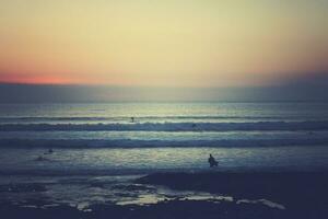 picturesque ocean landscape with the setting sun in a tropical country during summer holidays photo