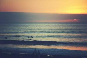 picturesque ocean landscape with the setting sun in a tropical country during summer holidays photo