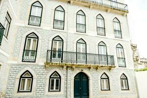 A white building with many windows photo