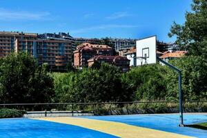 a blue and yellow basketball court photo