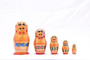a group of five wooden dolls photo