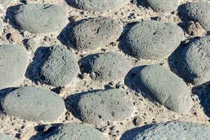 a close up of a stone path with rocks photo