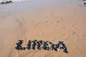 linda nombre escrito en el playa foto