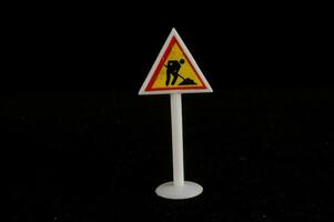 A road sign on black background photo