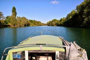 the view from the front of a boat on a river photo