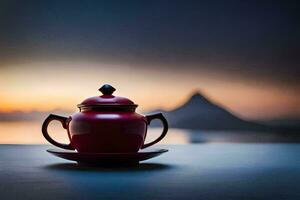 a red tea pot sits on a table in front of a mountain. AI-Generated photo