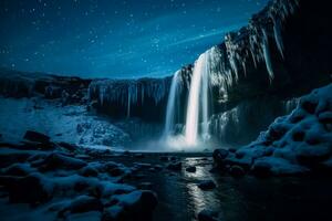 Nightfall explorer tackles towering frozen waterfall under the starlit sky photo