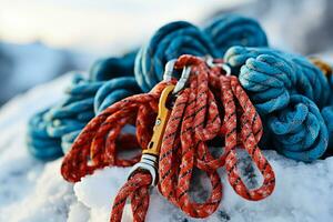 Frosty ropes and climbing tools background with empty space for text photo