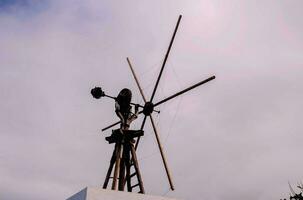 Wind propeller on a building photo