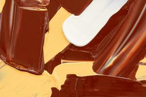 Mix chocolate and cream dripping texture background photo