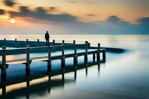 un hombre soportes en un muelle a puesta de sol. generado por ai foto