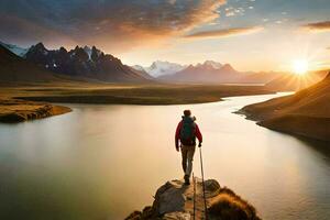 un hombre en pie en un rock con vista a un lago y montañas. generado por ai foto