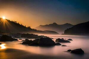 the sun rises over a mountain range and rocks on the beach. AI-Generated photo
