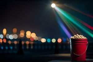 a bucket of popcorn on a table with lights behind it. AI-Generated photo