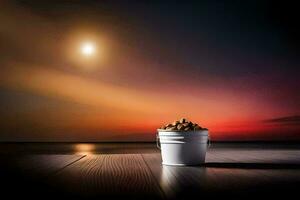 a bucket of nuts on a table in front of a sunset. AI-Generated photo