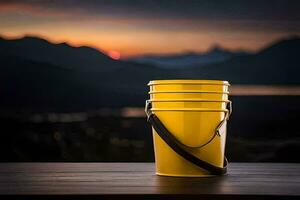 a yellow bucket sits on a table in front of a mountain. AI-Generated photo