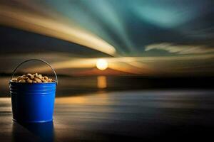 a blue bucket with peanuts on the beach at sunset. AI-Generated photo