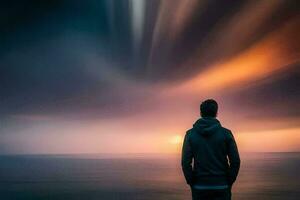 un hombre en pie en frente de el Oceano a puesta de sol. generado por ai foto