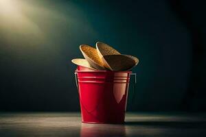 un rojo Cubeta lleno con papas fritas. generado por ai foto