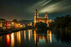 a cathedral lit up at night with a river in the background. AI-Generated photo