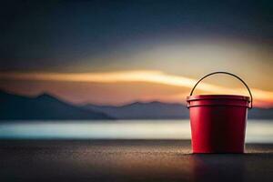 un rojo Cubeta sentado en el playa a puesta de sol. generado por ai foto