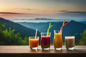 four glasses of juice on a table with mountains in the background. AI-Generated photo