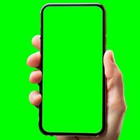 hand shows mobile smartphone with green screen in vertical position isolated on green background. Mock up mobile photo