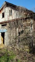 Old wooden barn. Abandoned wooden house. Antique wooden barn photo