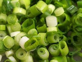 Green onions. Chopped green onions for salads. Culinary background of finely chopped onions photo