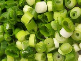 Green onions. Chopped green onions for salads. Culinary background of finely chopped onions photo