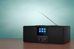 Black Portable Smart Wireless Speaker for Music. Smart device for Online Audio with Radio and Smartphone Wireless Charger. 3d Rendering photo