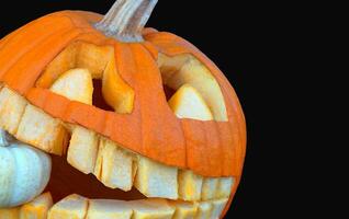 Spooky Carved Halloween Pumpkin on Eerie Black Background. Halloween and Black Friday Concepts photo