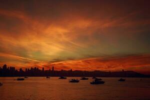 Sunset over Victoria Harbour in Hong Kong. Hong Kong is an autonomous territory on the southern coast of China. photo