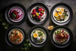 Set of different types of berry smoothies in bowls on dark background photo