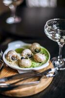 Escargot de Bourgogne, French dish made of snails photo