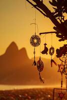 Beautiful dreamcatcher on the background of the sea and mountains. photo