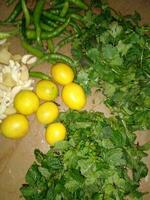 Vegetables and herbs on the table in the kitchen of a restaurant photo