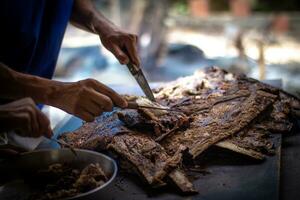 Grilled lamb ribs with knife on the street market in Thailand. photo