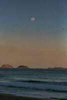 Moonrise over the sea in Ibiza, Balearic Islands, Spain photo