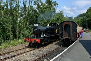 Bodmin, Cornwall, UK - June 13. Steam train at Bodmin General ra photo