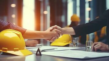 two people shaking hands over a table with hard hats. AI generative photo