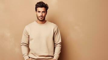 handsome young man in beige sweater posing against brown background. AI Generative photo