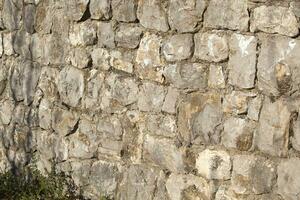 Stone texture. Ancient wall of stones with gray color. Background. Template. Photo in high quality. Horizontal.