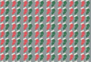 Festive Green and Red Christmas Stockings Pattern on Gray Background vector