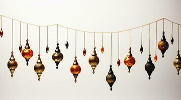 String of Golden Hanging Lanterns of Different Sizes on White Background photo